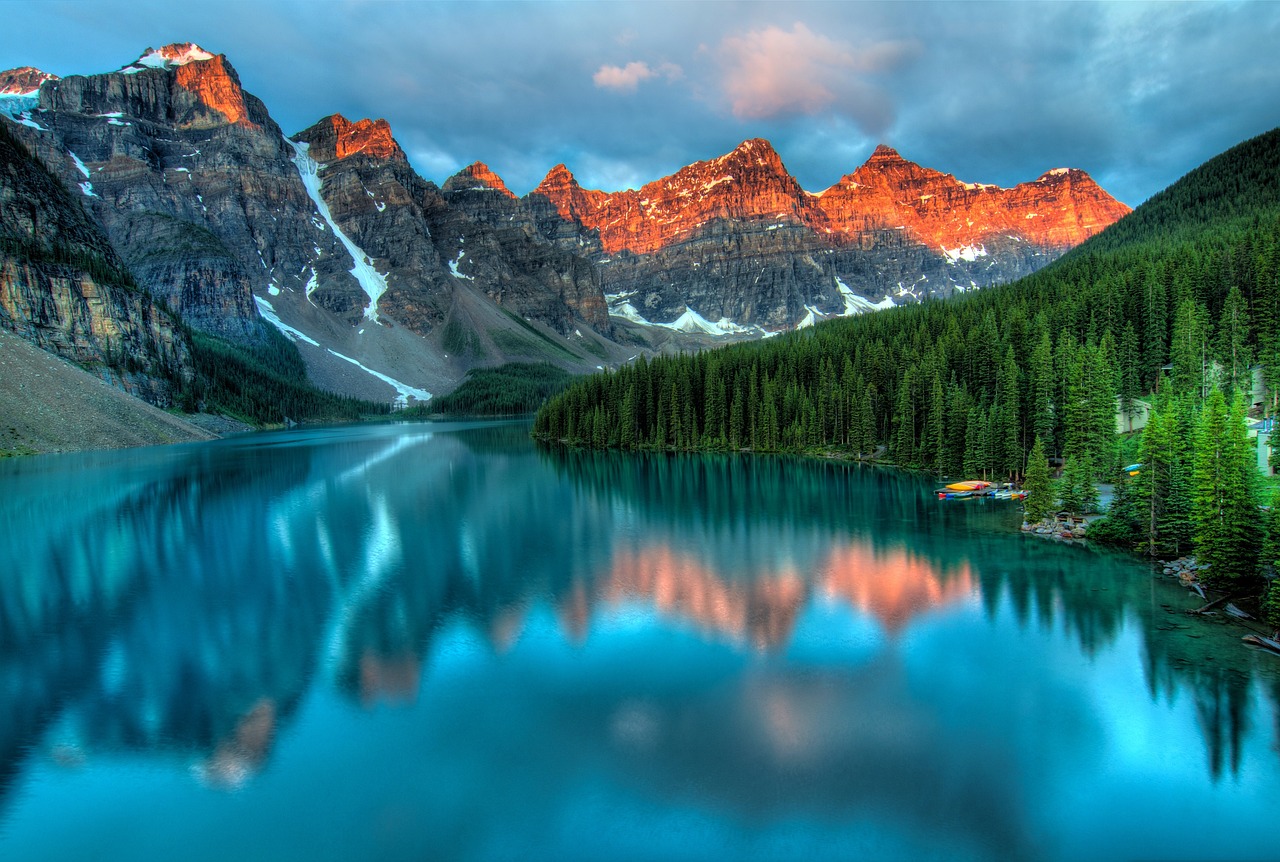 The breathtaking turquoise waters of Lake Louise, surrounded by majestic mountains.