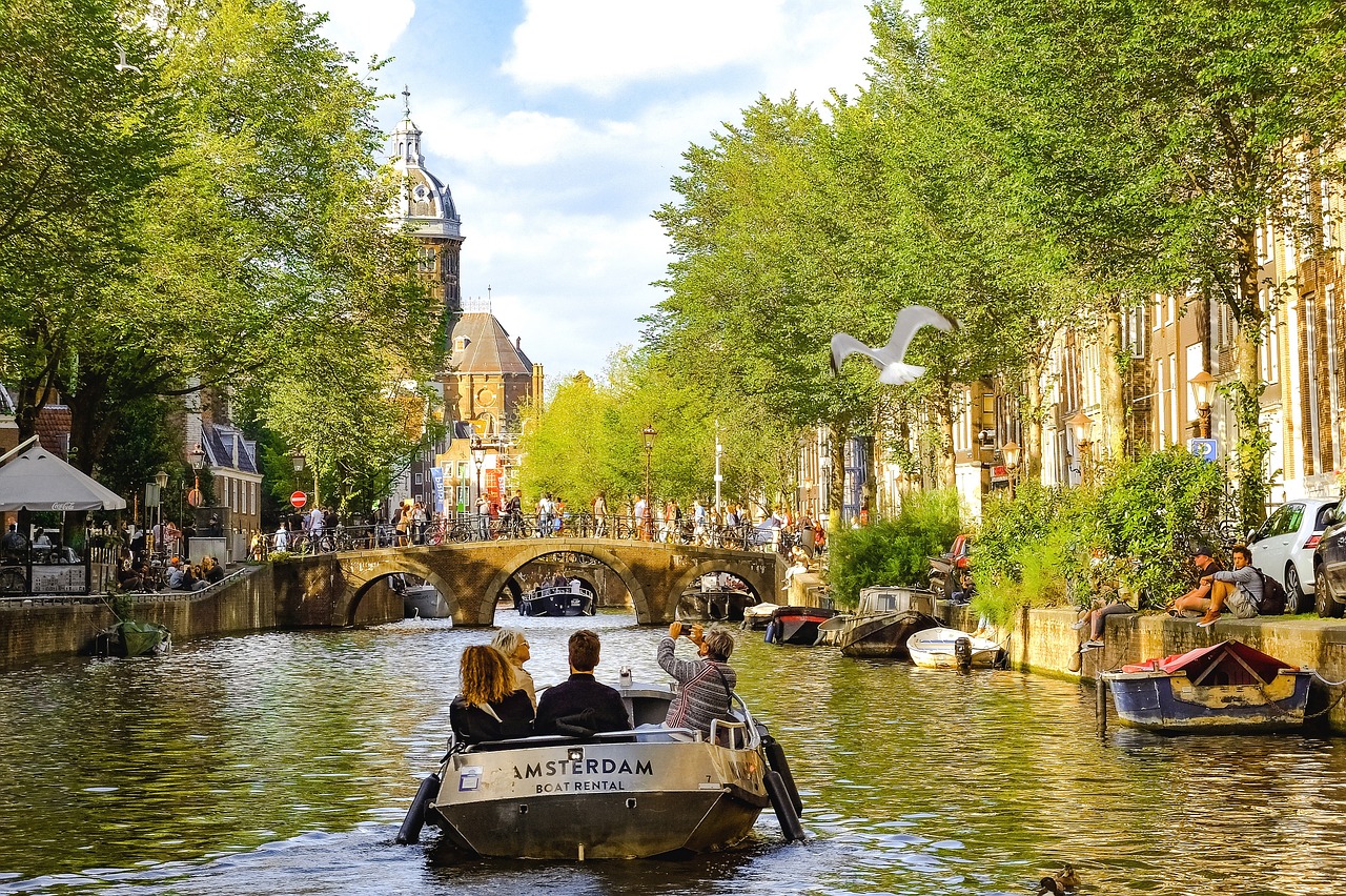 The picturesque canals of Amsterdam, lined with historic buildings.