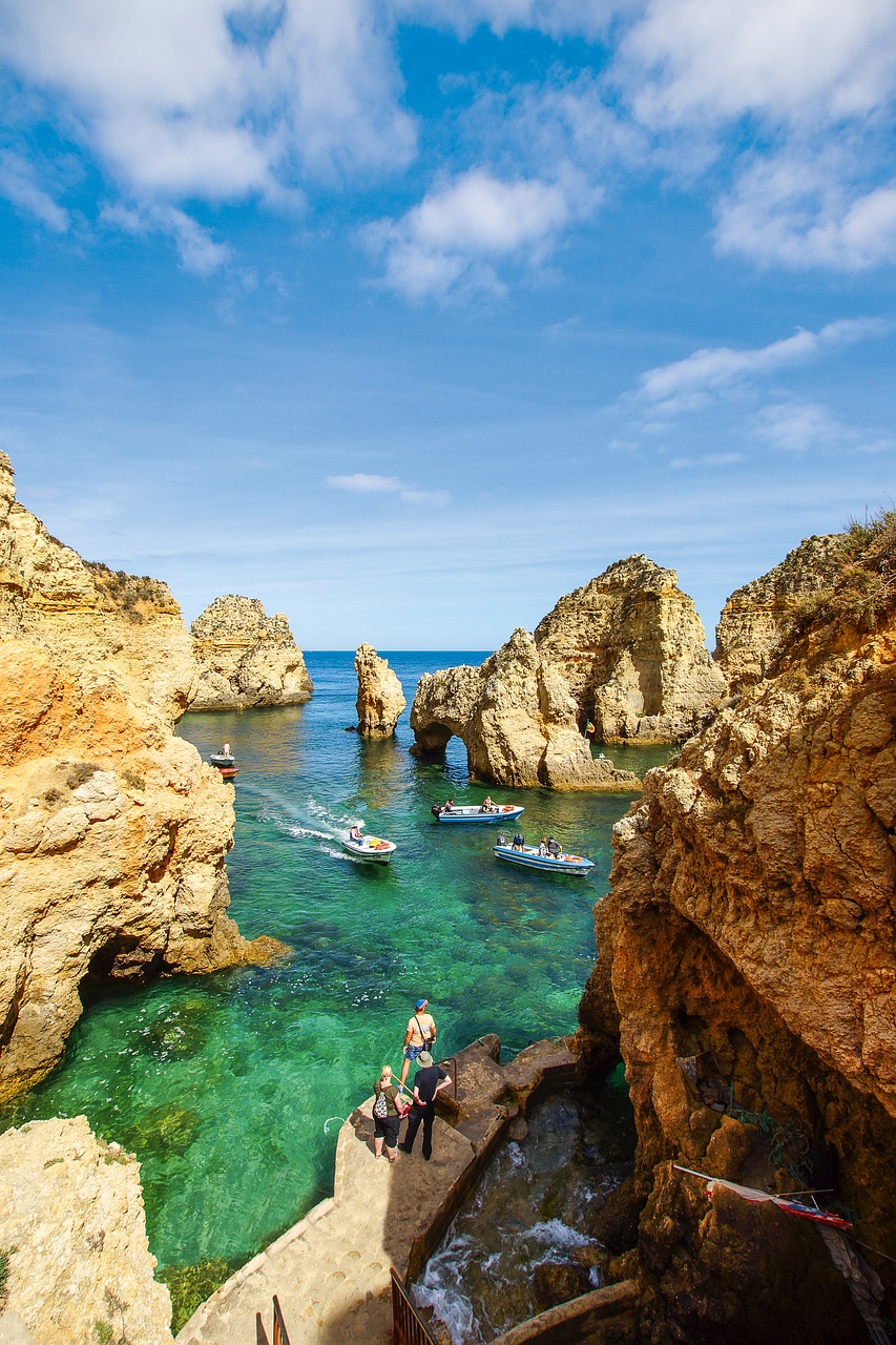 Dramatic limestone cliffs surrounding Praia da Marinha.